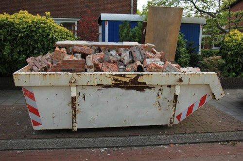 Crew clearing a Holborn garden with segregated waste containers